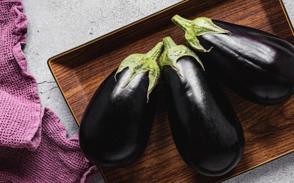eggplants-wooden-tray_23-2148758870